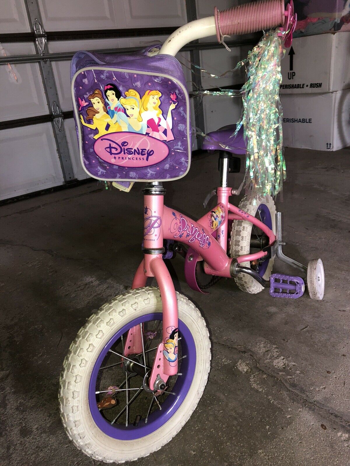 Girl’s bike - 12” Disney Princess w/ training wheels, bell and bag PICKUP ONLY - Fresh Stock Dated February 2026