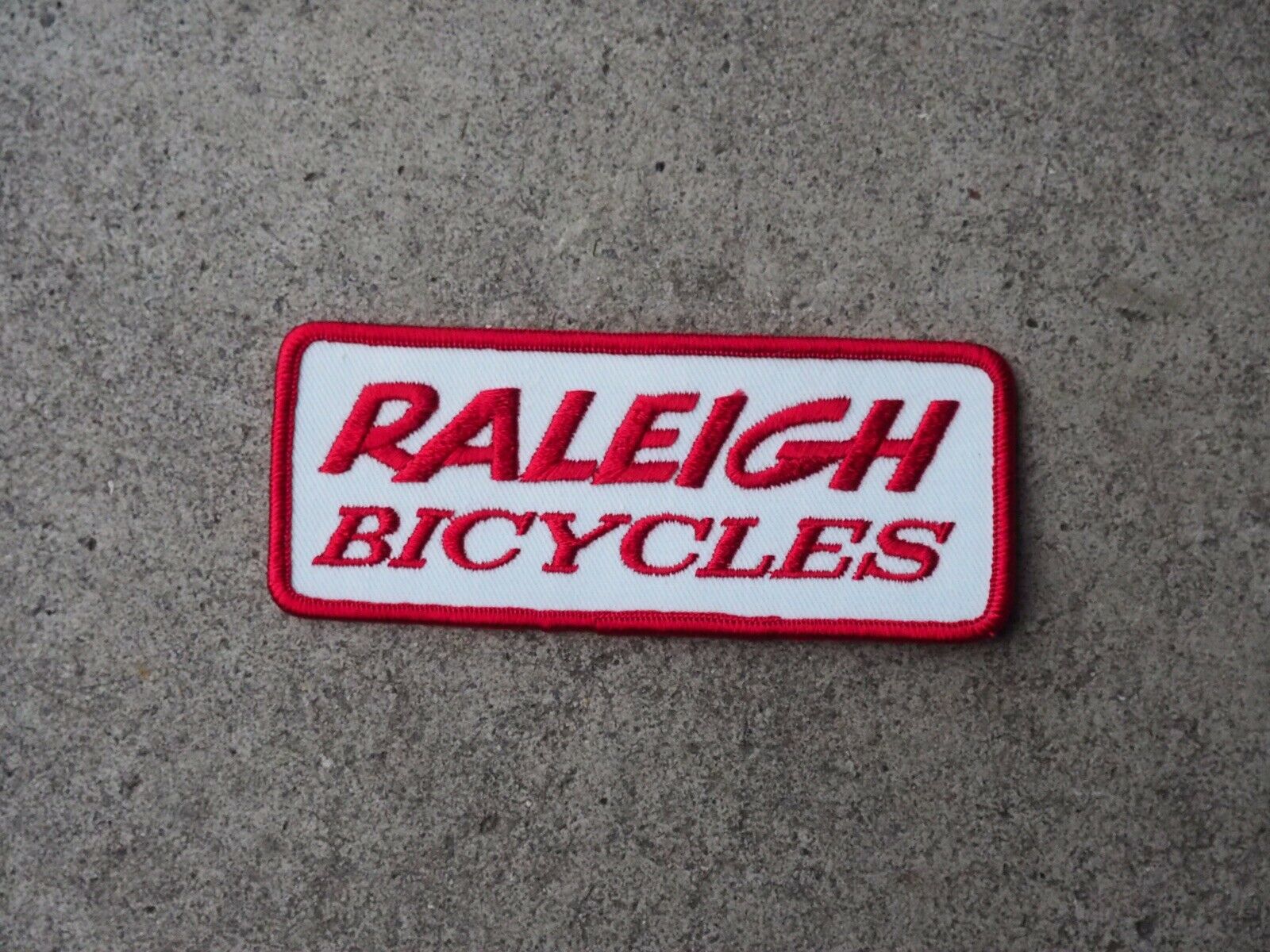 NOS Raleigh Bicycles Patch - Red And White - Raleigh Cycles - Fresh Stock Dated December 2025