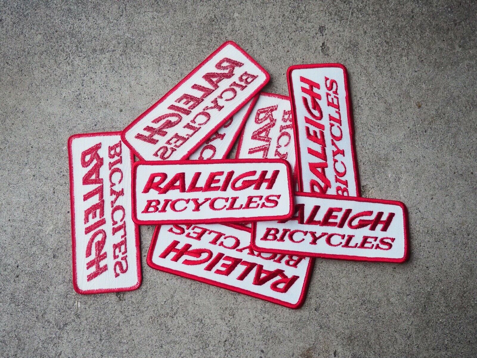 NOS Raleigh Bicycles Patch - Red And White - Raleigh Cycles - Fresh Stock Dated December 2025