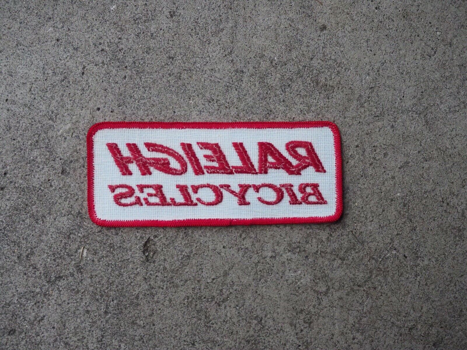 NOS Raleigh Bicycles Patch - Red And White - Raleigh Cycles - Fresh Stock Dated December 2025