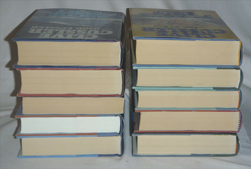 pick one - Clive Cussler - DIRK PITT - hardcover books - HC DJ firewood - one pb - Fresh Stock Dated December 2025