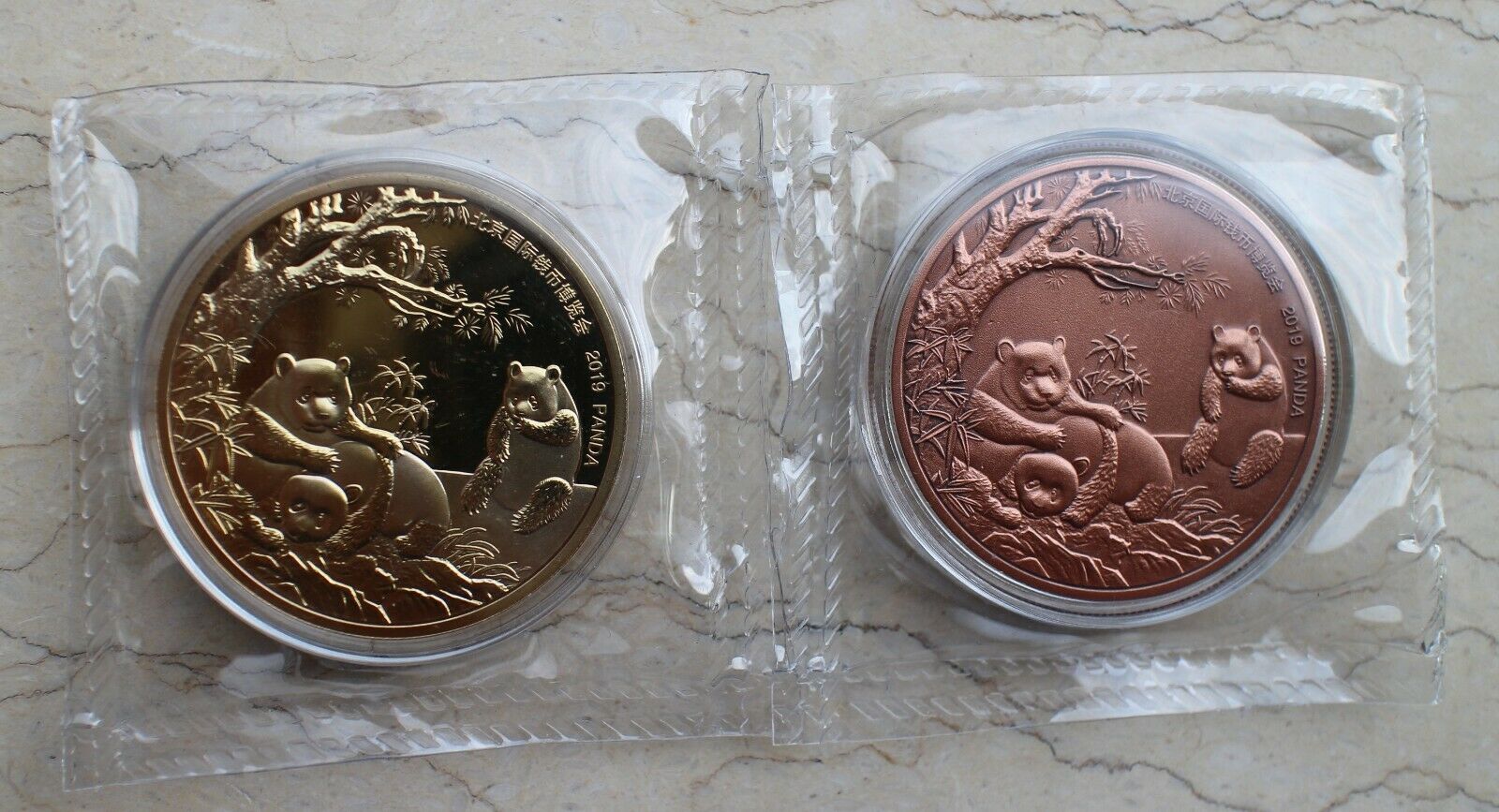 A Pair of 2019 China 40mm Copper & Gilt Copper Panda Medals - Beijing Coin Expo - Fresh Stock Dated February 2026