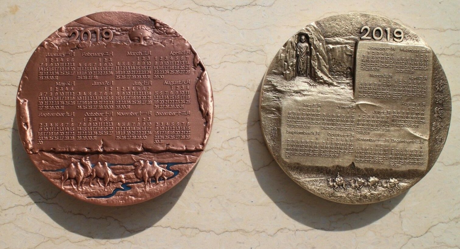 A Pair of China 76mm Enamel Medals (Brass and Copper) - Camel - 2019 Calendar - Fresh Stock Dated February 2026