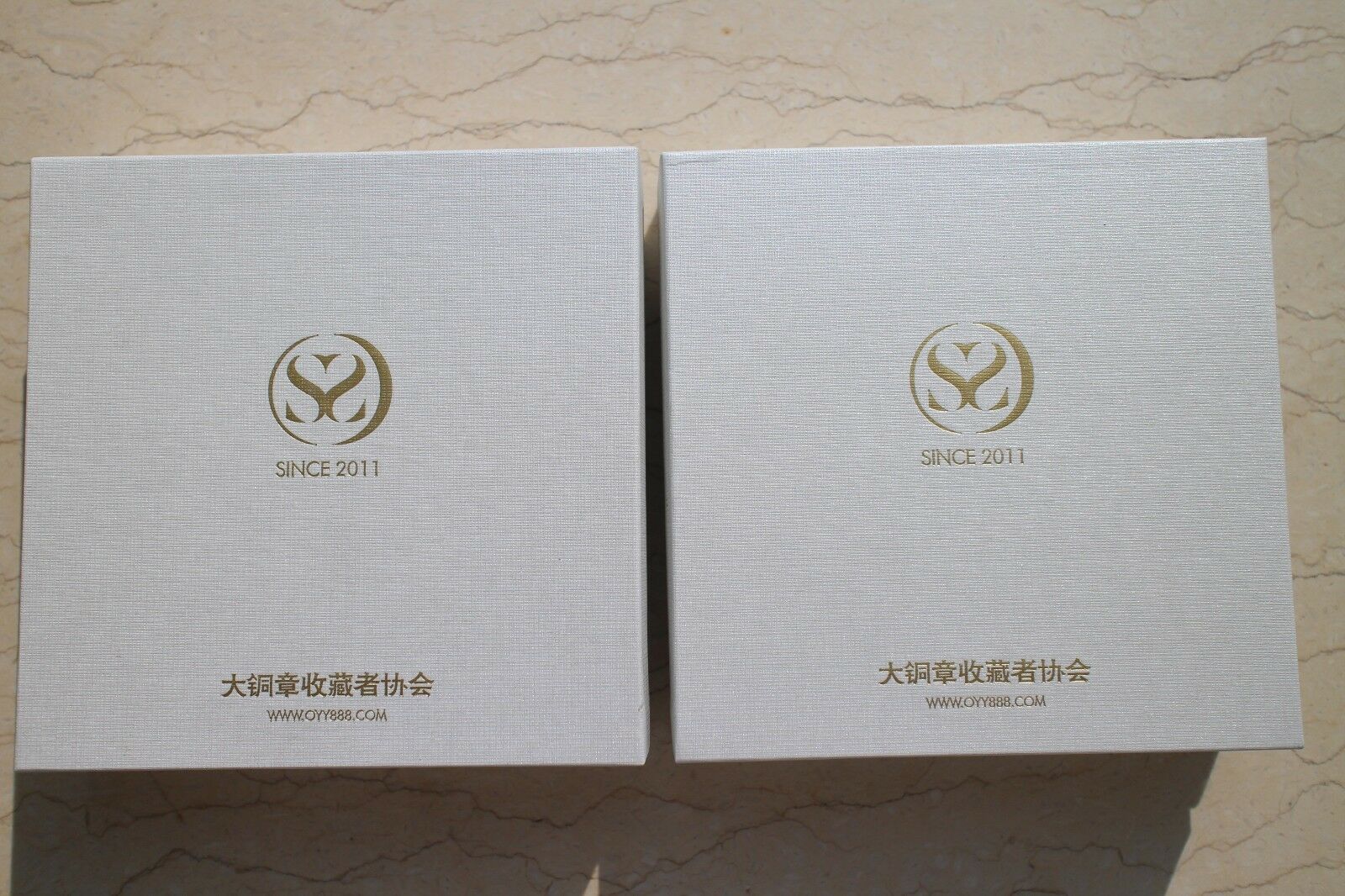 A Pair of China 76mm Enamel Medals (Brass and Copper) - Camel - 2019 Calendar - Fresh Stock Dated February 2026