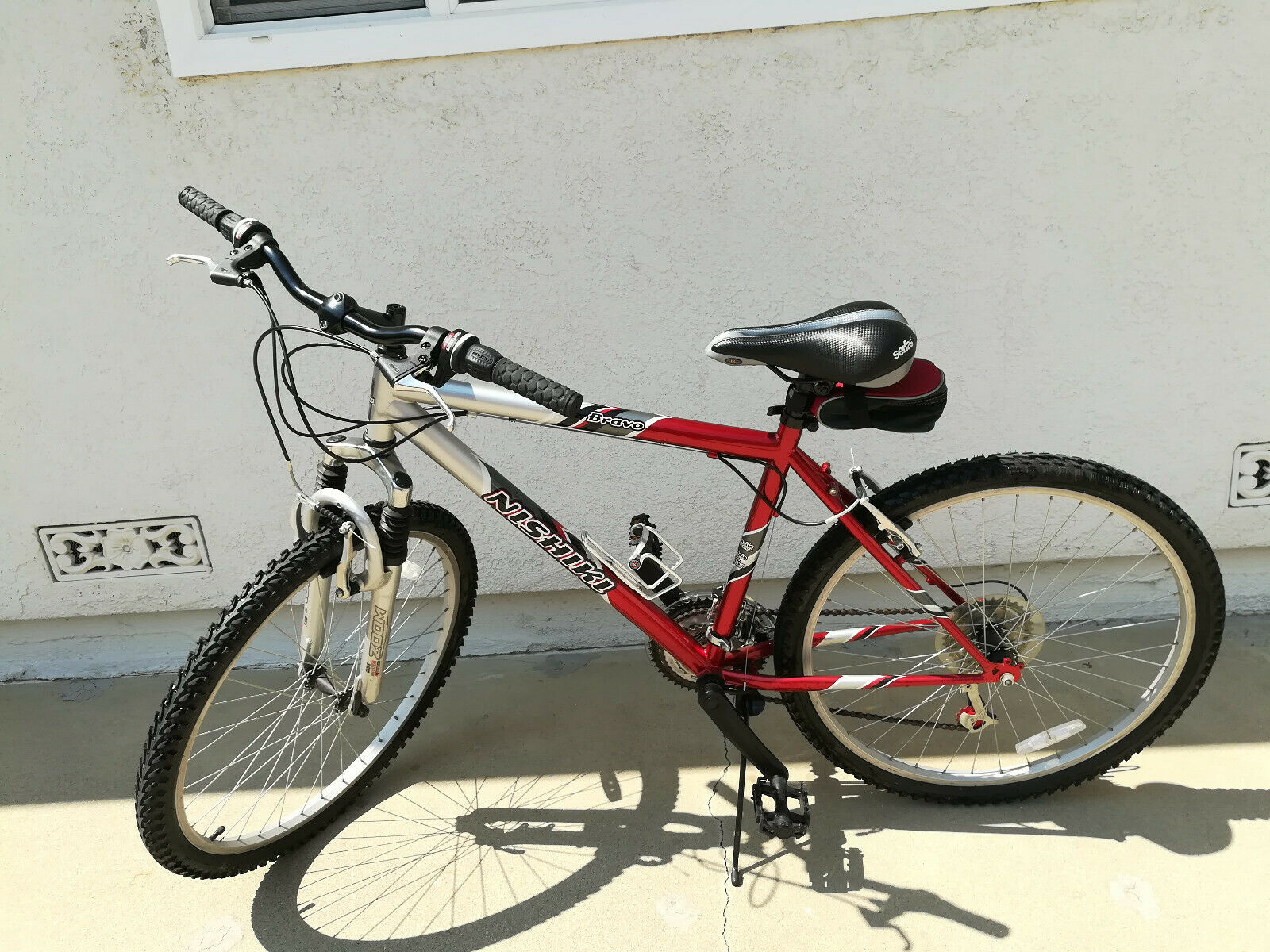 Used Men's Nishiki Bravo Shimano Mountain Bike, Red & Black Bike Sport Bike - Fresh Stock Dated February 2026