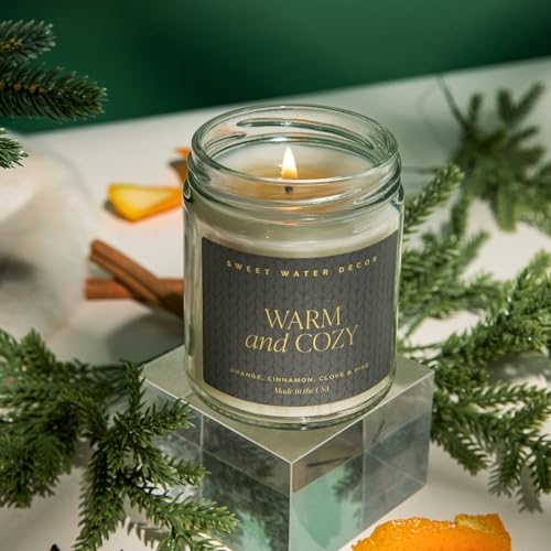 Sweet Water Decor Warm and Cozy Candle | Pine, Orange, Cinnamon, and Fir Winter Scented Soy Candles Fall Candle for Home | 9oz Clear Jar with Gold Foil Made in the USA